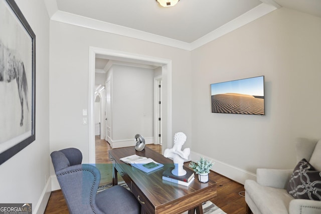 office area with crown molding, baseboards, arched walkways, and wood finished floors