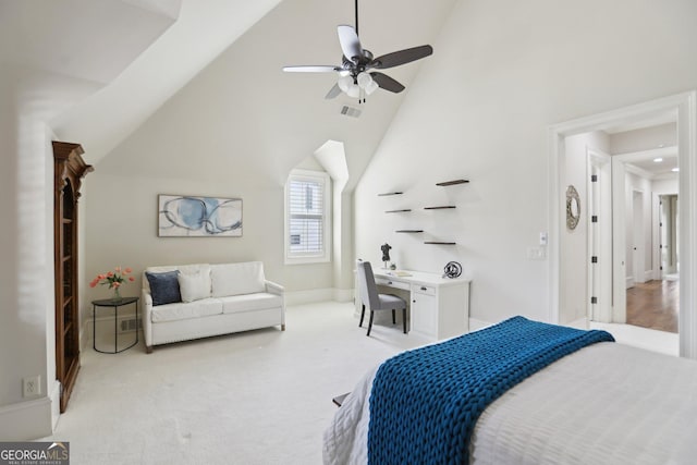 bedroom featuring baseboards, high vaulted ceiling, visible vents, and light colored carpet