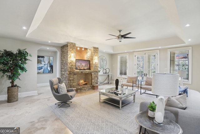 440 Belada Blvd, Sandy Springs, GA 30342 - living room with a tray ceiling, ceiling fan, a stone fireplace, and recessed lighting