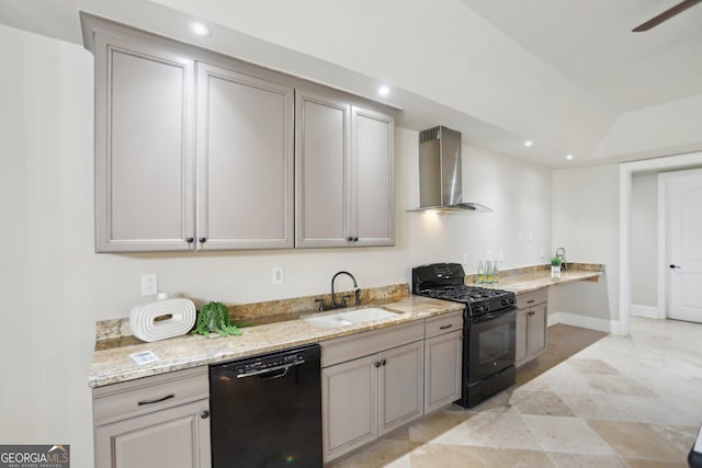 kitchen with wall chimney exhaust hood, light stone countertops, black appliances, a sink, and recessed lighting