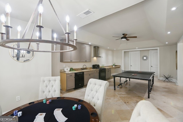 recreation room with recessed lighting, a raised ceiling, visible vents, a sink, and ceiling fan with notable chandelier