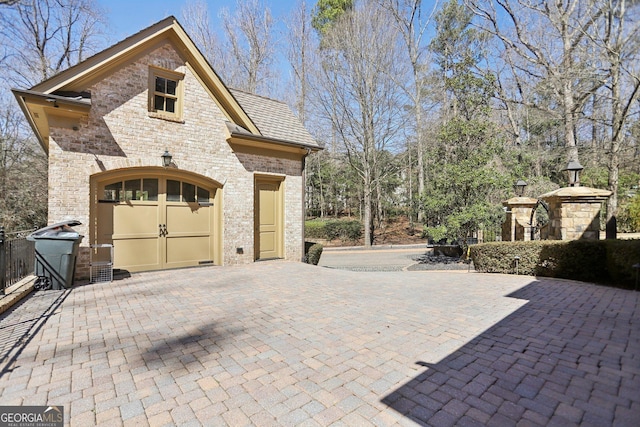 view of side of property featuring stone siding