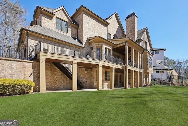 440 Belada Blvd, Sandy Springs, GA 30342 - rear view of property featuring a lawn, stairway, a chimney, and brick siding