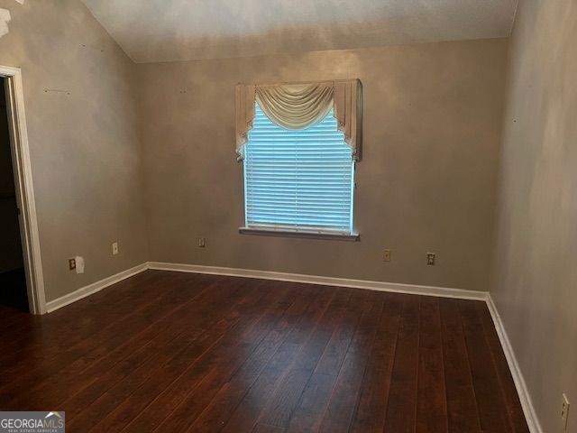 355 Tait Rd, Stockbridge, GA 30281 - unfurnished room with dark wood finished floors and baseboards