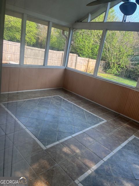 355 Tait Rd, Stockbridge, GA 30281 - unfurnished sunroom featuring a ceiling fan, healthy amount of natural light, and lofted ceiling
