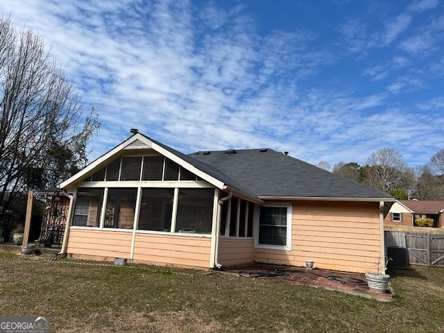 355 Tait Rd, Stockbridge, GA 30281 - back of house with a sunroom and central AC unit