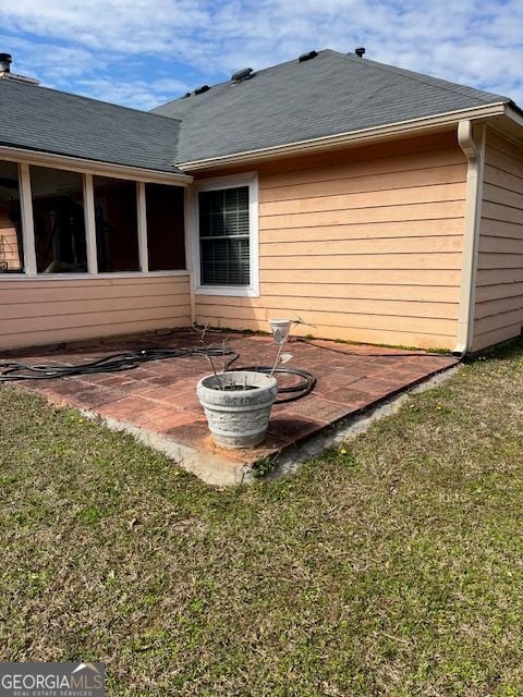 355 Tait Rd, Stockbridge, GA 30281 - rear view of house featuring a patio, a yard, and a shingled roof