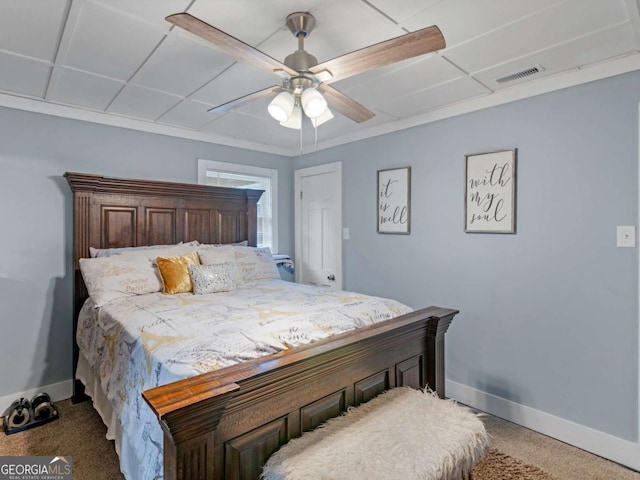 bedroom featuring carpet, visible vents, baseboards, and ceiling fan