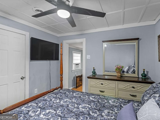 bedroom with a ceiling fan, cooling unit, and visible vents