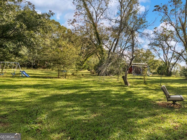 view of yard featuring playground community