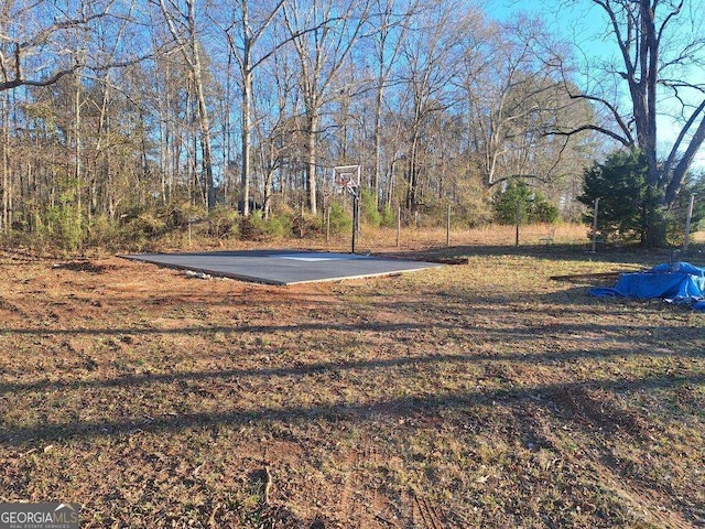 view of yard featuring community basketball court