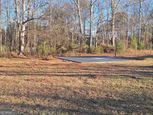 view of yard with community basketball court