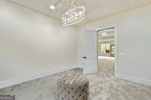 2634 Greenes Ln, Powder Springs, GA 30127 - carpeted empty room with visible vents, baseboards, and a notable chandelier