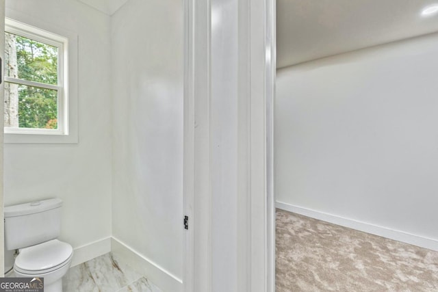 2634 Greenes Ln, Powder Springs, GA 30127 - bathroom featuring toilet, baseboards, and marble finish floor