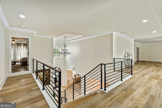 2634 Greenes Ln, Powder Springs, GA 30127 - stairs with ornamental molding, baseboards, an inviting chandelier, and wood finished floors