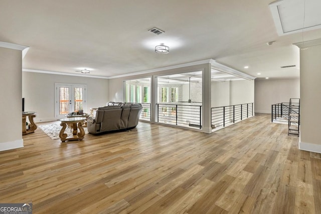 2634 Greenes Ln, Powder Springs, GA 30127 - living area featuring attic access, crown molding, wood finished floors, and visible vents