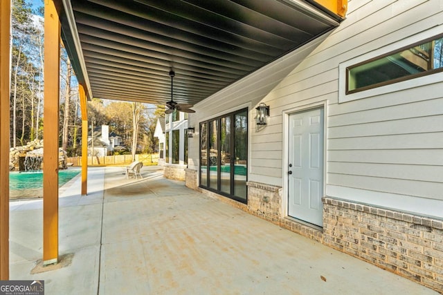 2634 Greenes Ln, Powder Springs, GA 30127 - view of patio with an outdoor pool, a ceiling fan, and fence