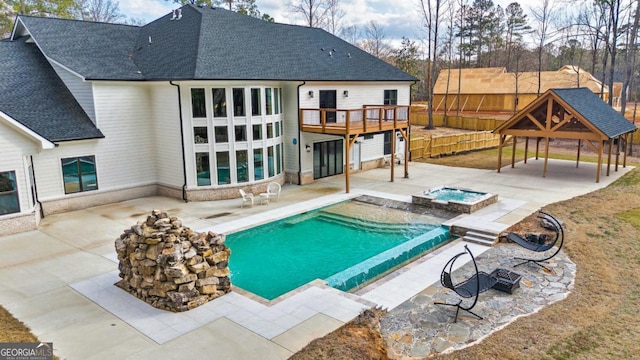 2634 Greenes Ln, Powder Springs, GA 30127 - pool featuring a patio area, an in ground hot tub, and fence