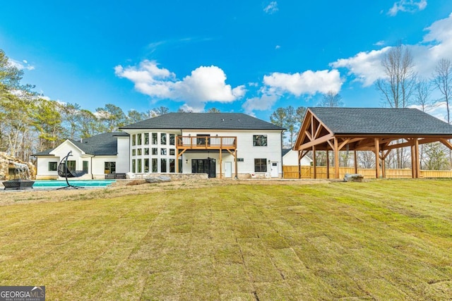 2634 Greenes Ln, Powder Springs, GA 30127 - rear view of property with an outdoor pool, a yard, and fence