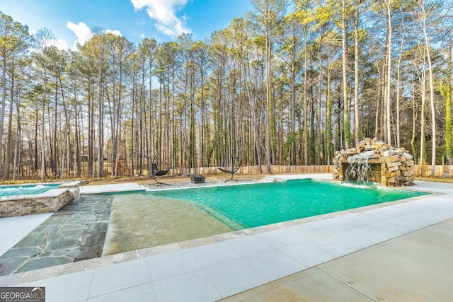 2634 Greenes Ln, Powder Springs, GA 30127 - view of swimming pool featuring fence, a pool with connected hot tub, and a patio area
