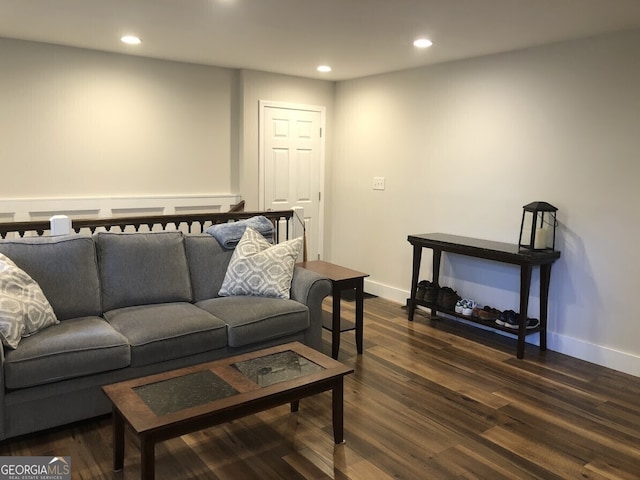 living area with recessed lighting, dark wood finished floors, and baseboards