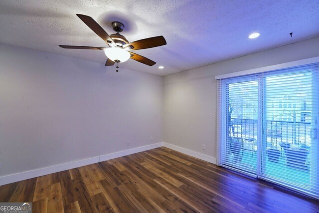 unfurnished room featuring a textured ceiling, ceiling fan, recessed lighting, wood finished floors, and baseboards