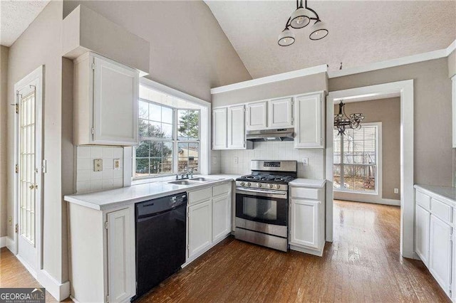 kitchen featuring light countertops, stainless steel range with gas stovetop, dishwasher, and white cabinetry