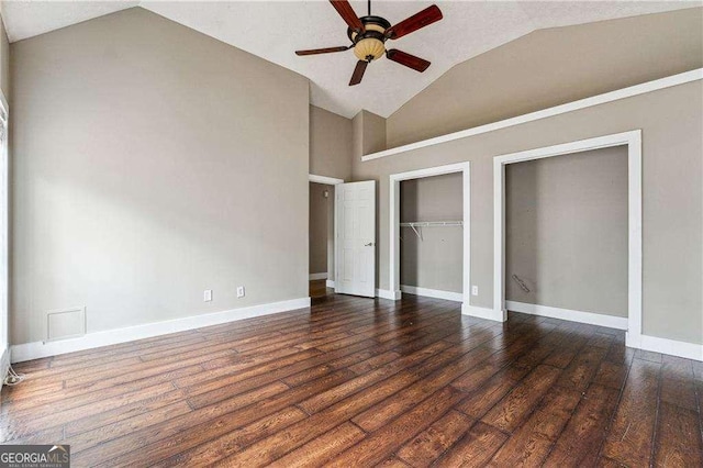 unfurnished bedroom featuring vaulted ceiling, ceiling fan, dark wood-style floors, and baseboards