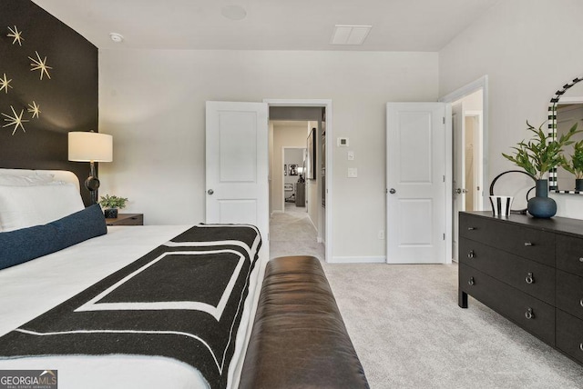 bedroom with light colored carpet, visible vents, and baseboards