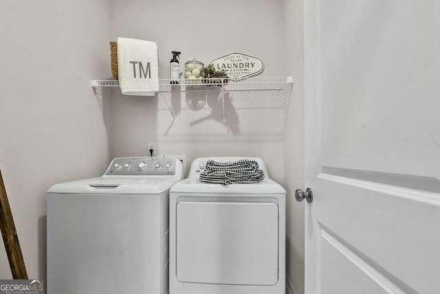 washroom with laundry area and independent washer and dryer