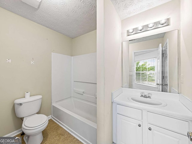 full bath featuring baseboards, a textured ceiling, toilet, and vanity