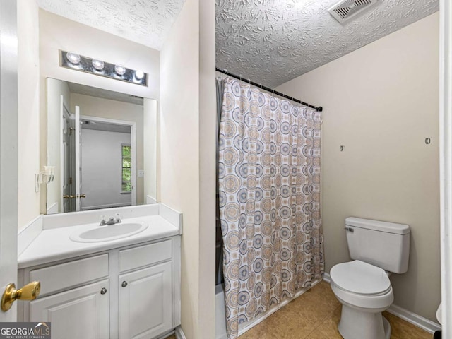 full bath featuring baseboards, visible vents, toilet, a textured ceiling, and vanity