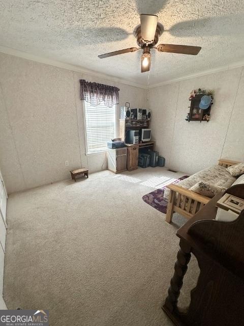 interior space with a textured ceiling, ornamental molding, and carpet flooring