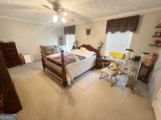 bedroom featuring light carpet, ornamental molding, and a textured ceiling