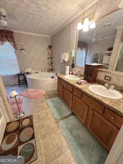 full bathroom with crown molding, a sink, a textured ceiling, and a ceiling fan