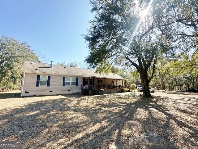 back of property with crawl space