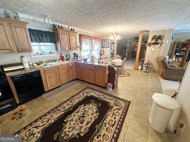 kitchen with black dishwasher, crown molding, light countertops, a sink, and a chandelier