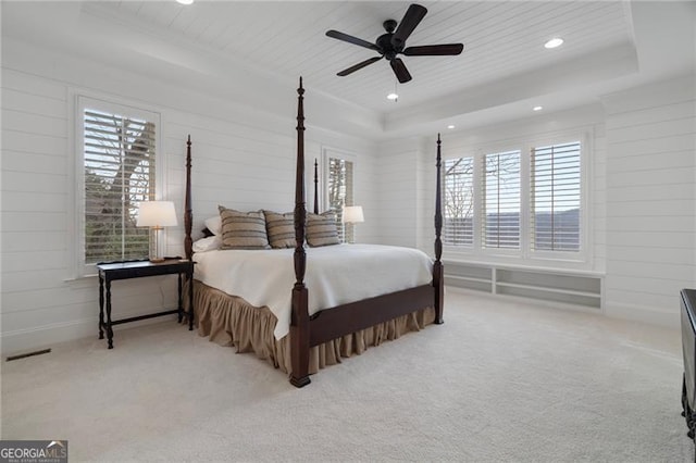 bedroom with a tray ceiling, wood ceiling, light colored carpet, and recessed lighting