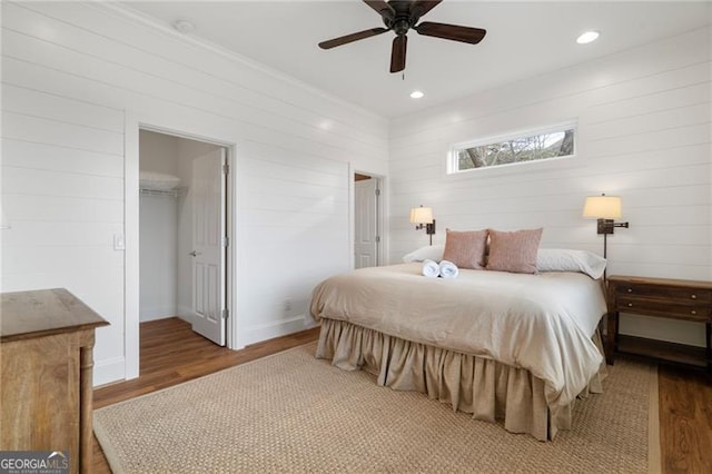 bedroom with recessed lighting, ceiling fan, baseboards, and wood finished floors