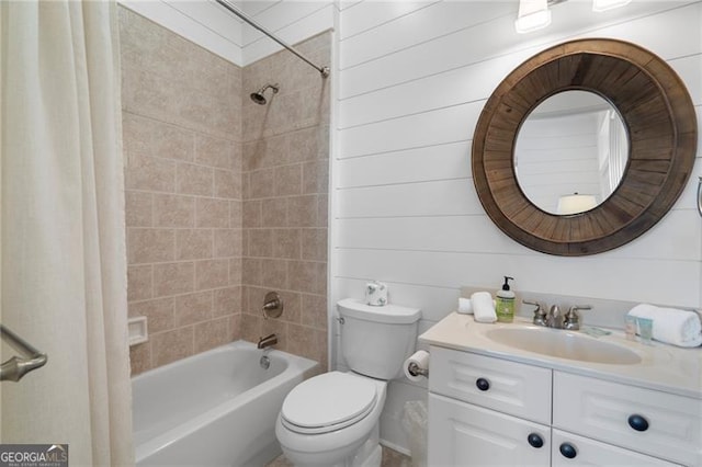 bathroom with shower / bathing tub combination, vanity, and toilet