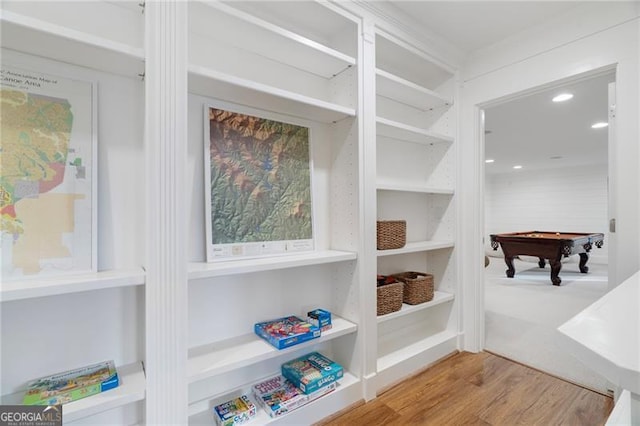 spacious closet featuring pool table and light wood-style floors