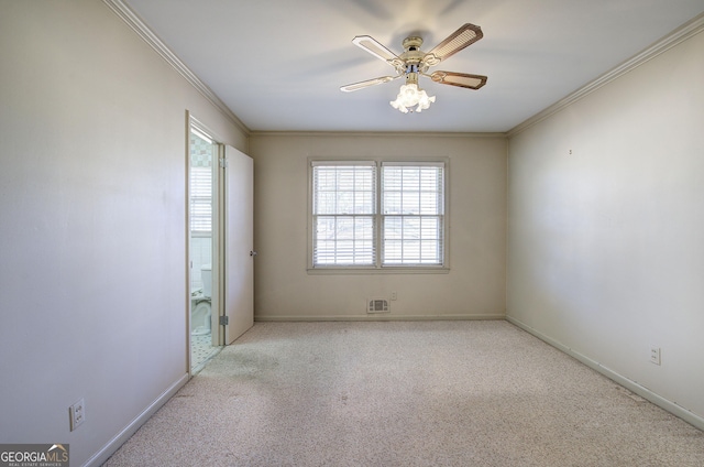 empty room featuring baseboards, carpet, a ceiling fan, and crown molding