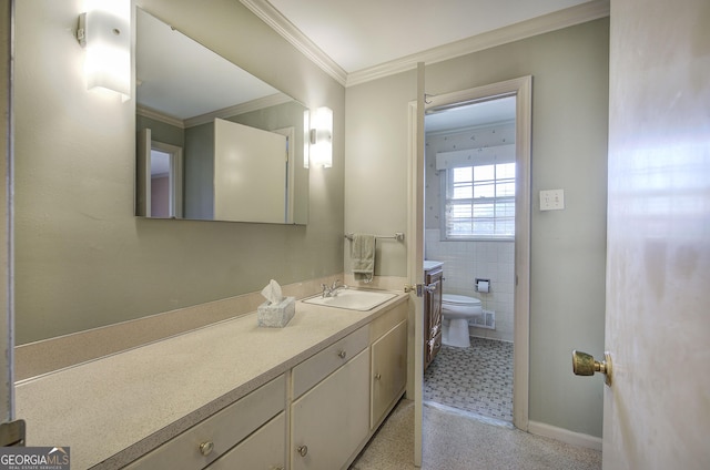 bathroom with visible vents, toilet, ornamental molding, vanity, and tile walls