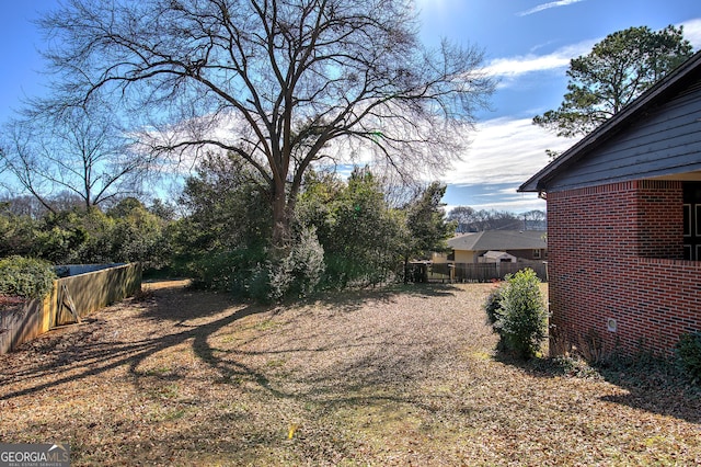 view of yard featuring fence