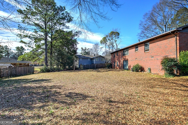 view of yard with fence