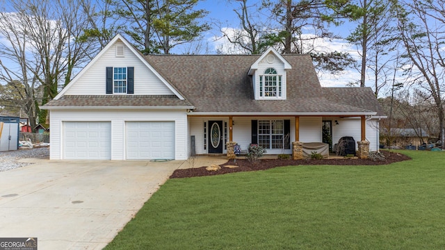 view of front of home with driveway, a front lawn, a porch, and a shingled roof