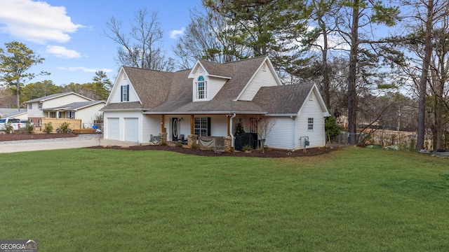 view of front of home featuring a porch, a front yard, concrete driveway, and roof with shingles