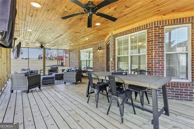 deck with ceiling fan, an outdoor living space, and outdoor dining space