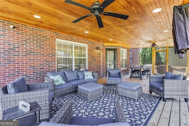 deck featuring a ceiling fan, outdoor dining space, and an outdoor living space