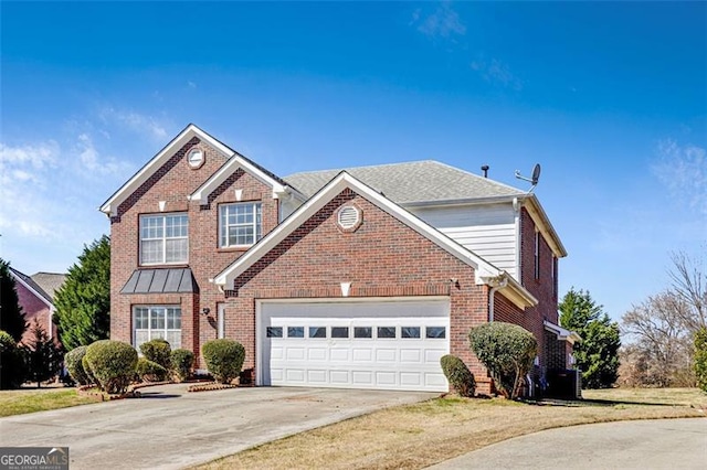 traditional-style home with a garage, concrete driveway, brick siding, and central AC